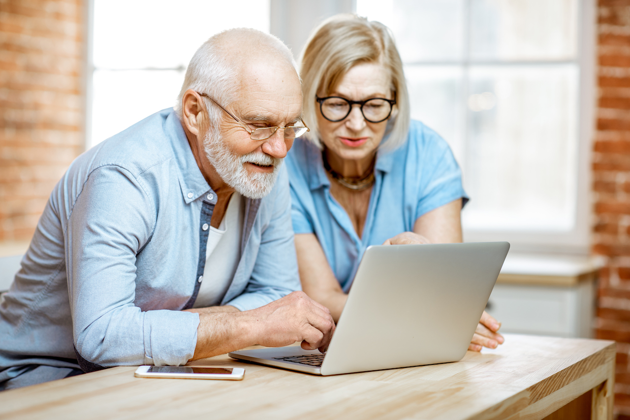 Elderly couple with laptop feature